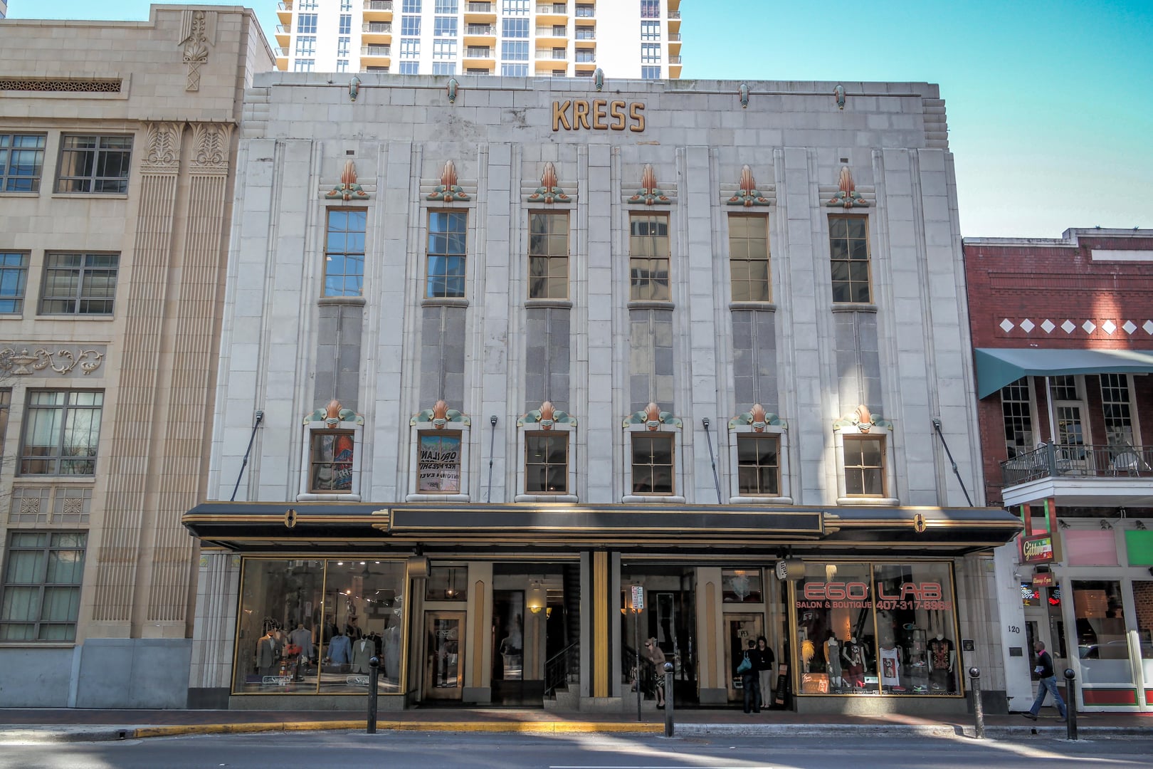 The 1936 Art Deco Kress Building at the corner of Church Street and Orange Avenue in downtown Orlando, Florida — featuring polychrome terra-cotta facades with stylized parrots and sunburst designs