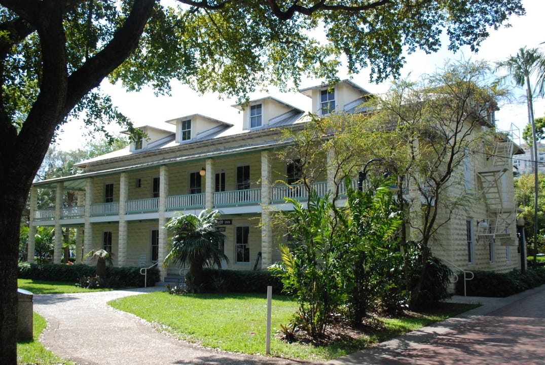 Long angled view of the New River Inn's two-story porches and row of roof dormers, Fort Lauderdale, Florida, 2006.