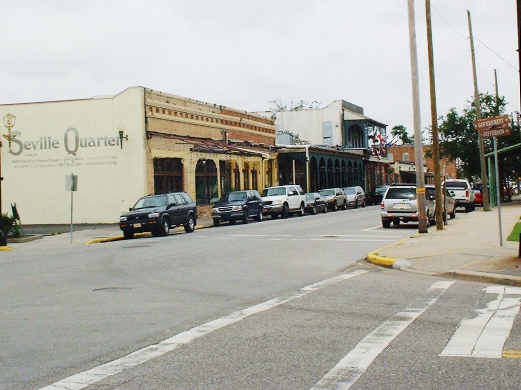 Exterior of Seville Quarter at 130 East Government Street in Pensacola, Florida — the 1871 former cigar warehouse converted into a multi-venue nightlife complex.