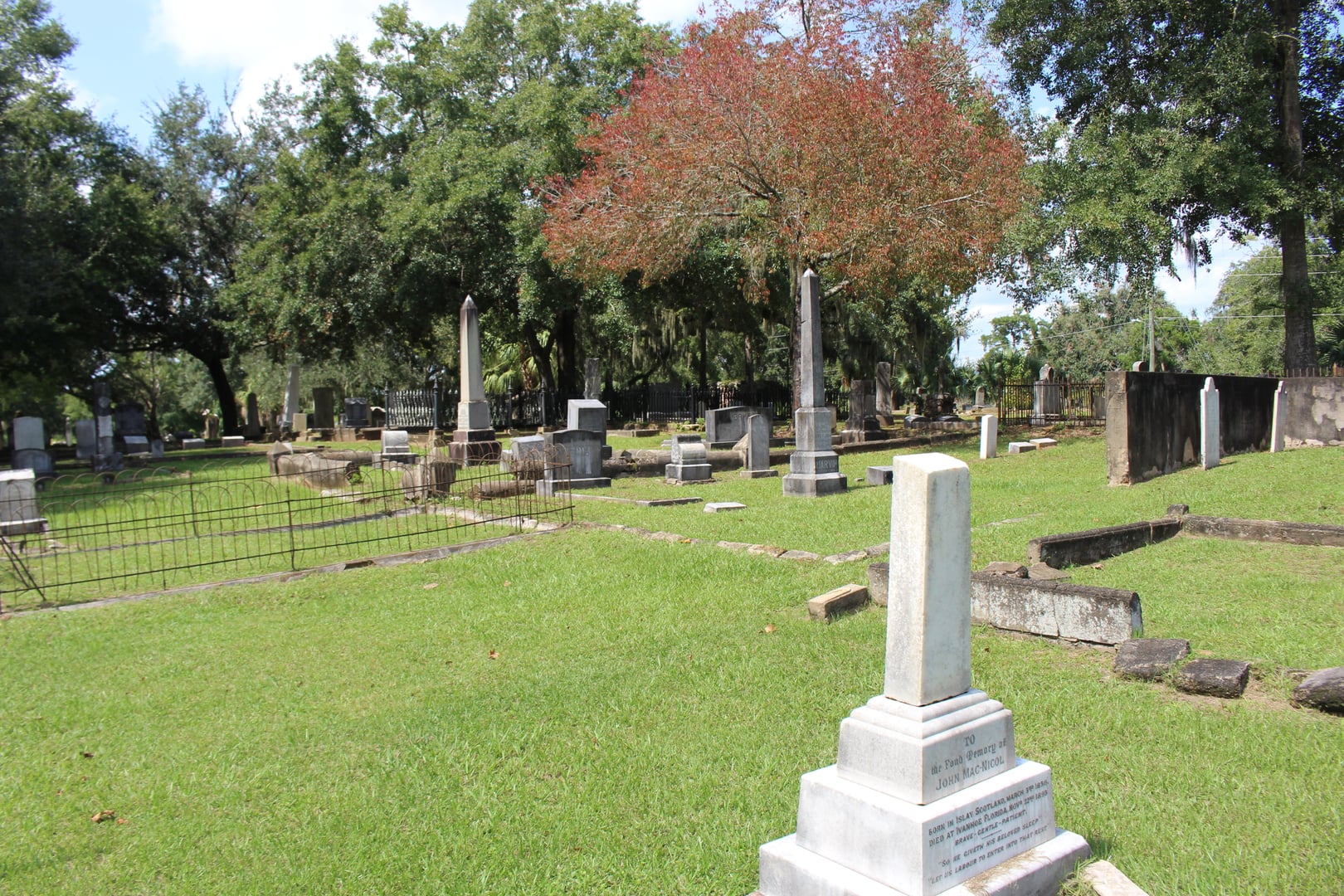 Weathered headstones beneath spreading oaks at the 1829 Old City Cemetery, Tallahassee's first public burial ground, Florida
