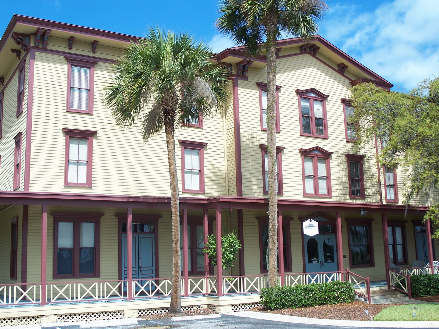 Exterior of the 1885 three-story frame Longwood Hotel in the Longwood Historic District, Longwood, Florida — listed on the National Register of Historic Places.