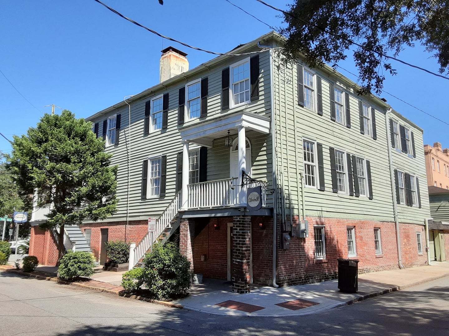 Three-story brick corner building of 17Hundred90 Inn at 130-132 Lincoln Street, Savannah, Georgia, photographed in 2021