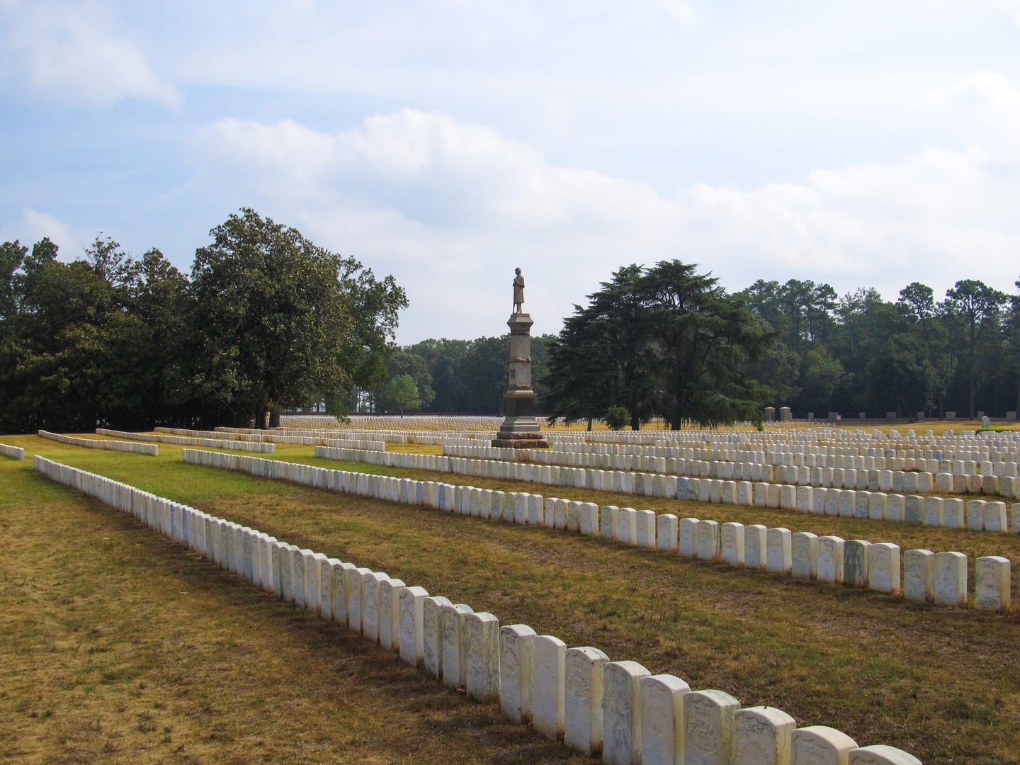 Rows of white marble headstones at Andersonville National Cemetery in Andersonville, Georgia, marking the graves of Union prisoners who died at Camp Sumter.