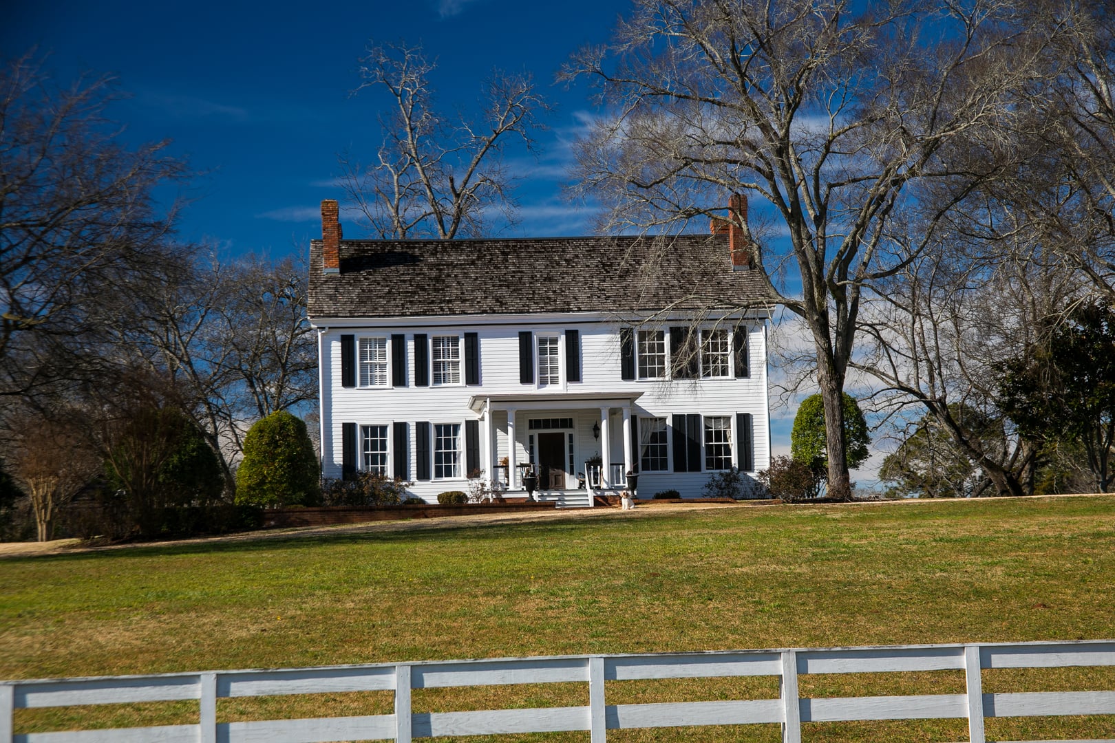 Two-and-a-half-story gabled frame plantation house with grounds in Greene County, Georgia