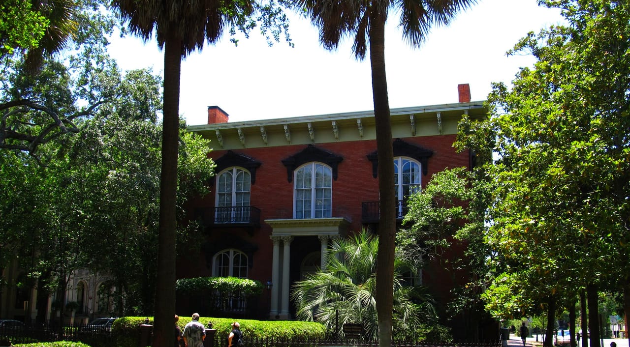 The Mercer-Williams House viewed across Monterey Square through live oaks, Savannah, Georgia, 2011.