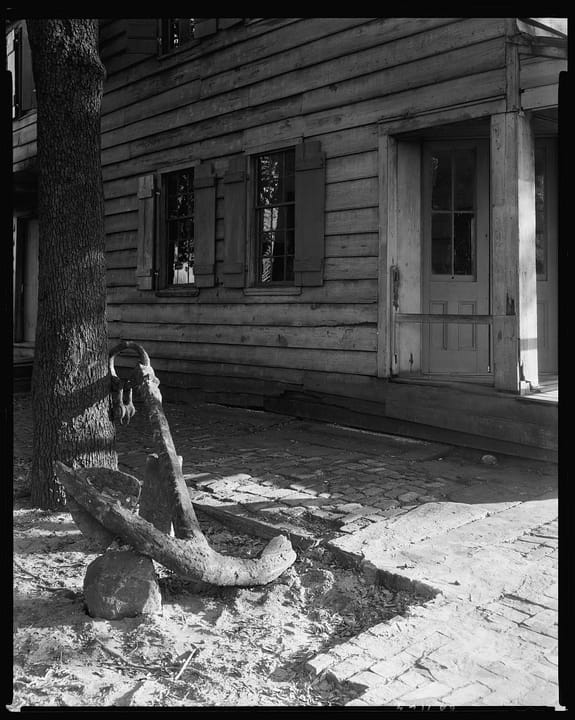A 1939 or 1944 close view of the Pirates' House entrance, Savannah, with an old anchor and chain displayed outside, by Frances Benjamin Johnston.