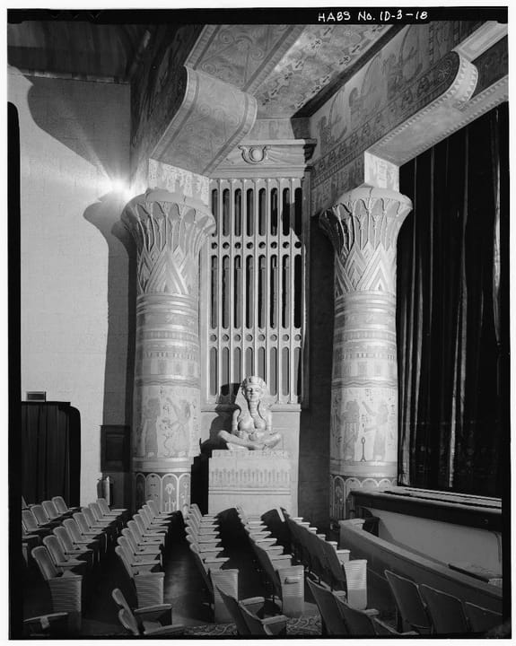 Inside the Egyptian Theatre's auditorium, the Egyptian Revival columns with lotus capitals and hieroglyph-style ornament that flank the screen, from the HABS documentation of the building.