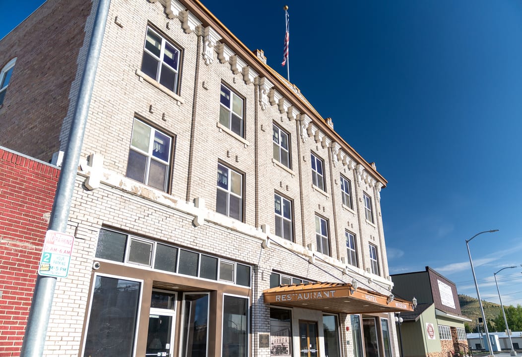 Three-story brick facade of the historic 1917 Enders Hotel on Main Street in Soda Springs, Idaho, listed on the National Register of Historic Places.
