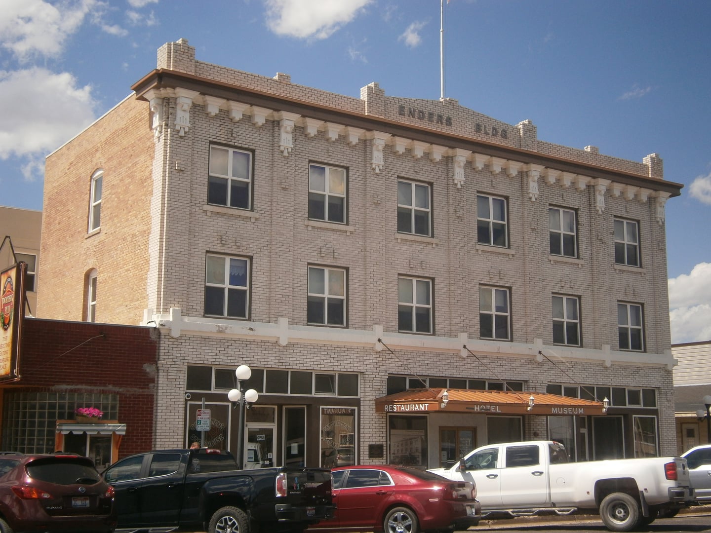Three-story brick facade of the historic 1917 Enders Hotel on Main Street in Soda Springs, Idaho, listed on the National Register of Historic Places.