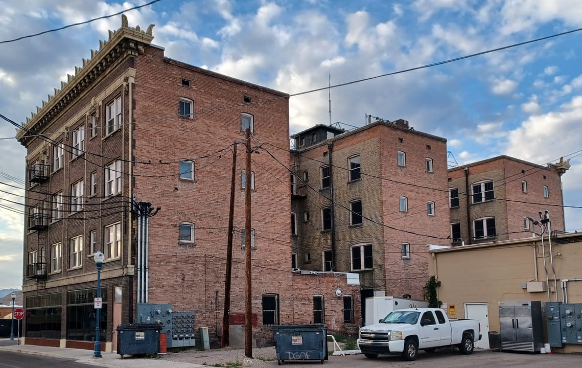 The rear elevation of the Hotel Yellowstone building, showing the full four-story brick massing.