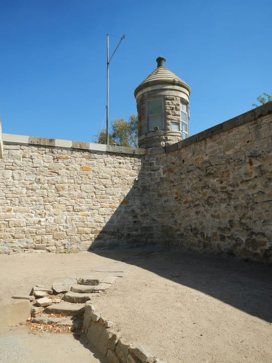 A sandstone perimeter wall and corner guard turret at the Old Idaho State Penitentiary, Boise, Idaho.