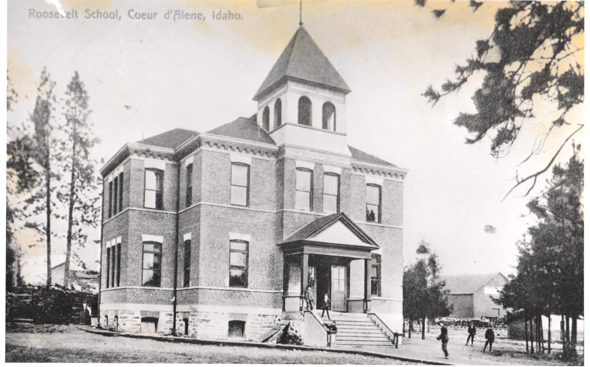 Three-story brick former schoolhouse that houses the Roosevelt Inn in Coeur d'Alene, Idaho