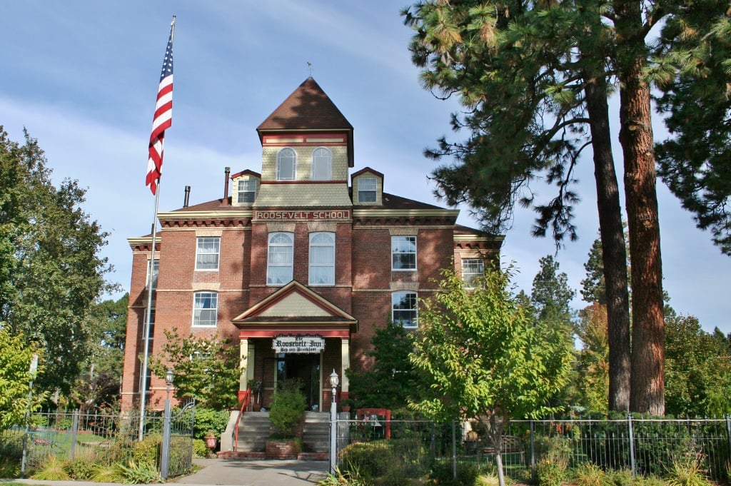 Three-story brick former schoolhouse that houses the Roosevelt Inn in Coeur d'Alene, Idaho