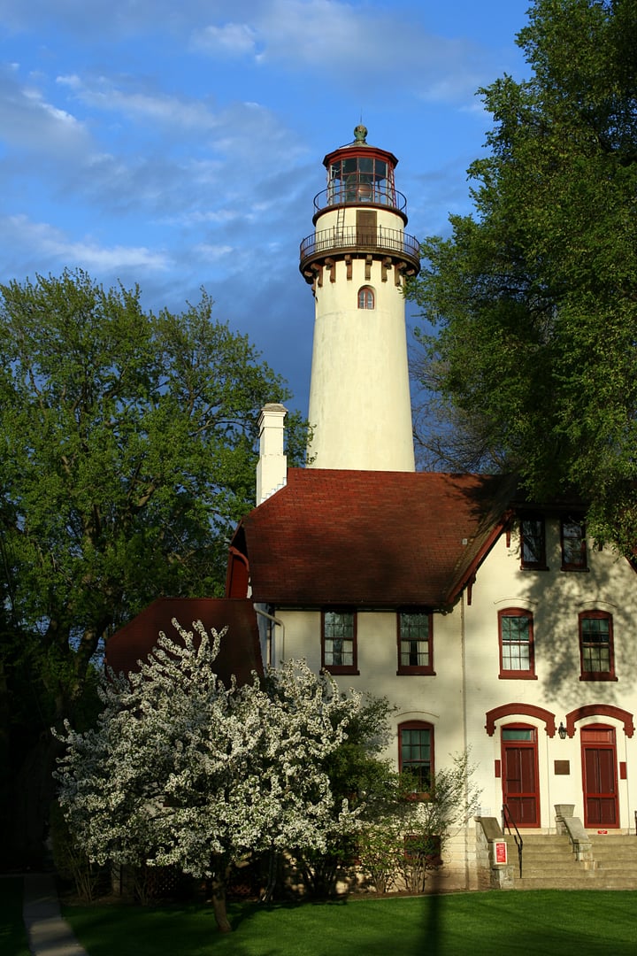 The 113-foot Grosse Point Lighthouse tower rising above the shoreline of Lake Michigan in Evanston, Illinois