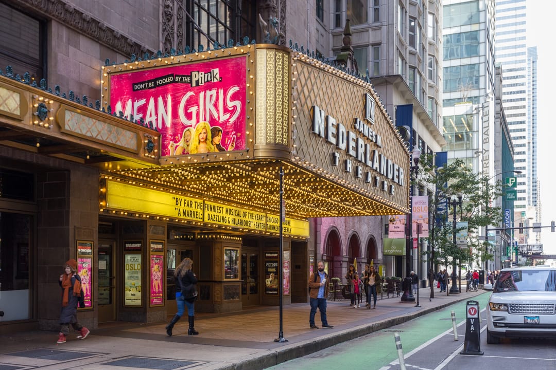 Daytime street-level view of the James M. Nederlander Theatre's marquee and facade at 24 W. Randolph St, Chicago, the marquee reading "James M. Nederlander Theatre."