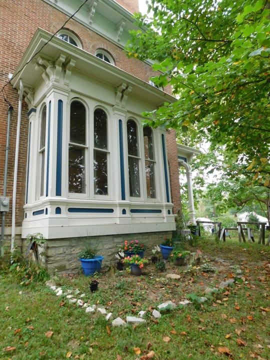 Close detail of the mansion's restored bay-window conservatory, September 2017.