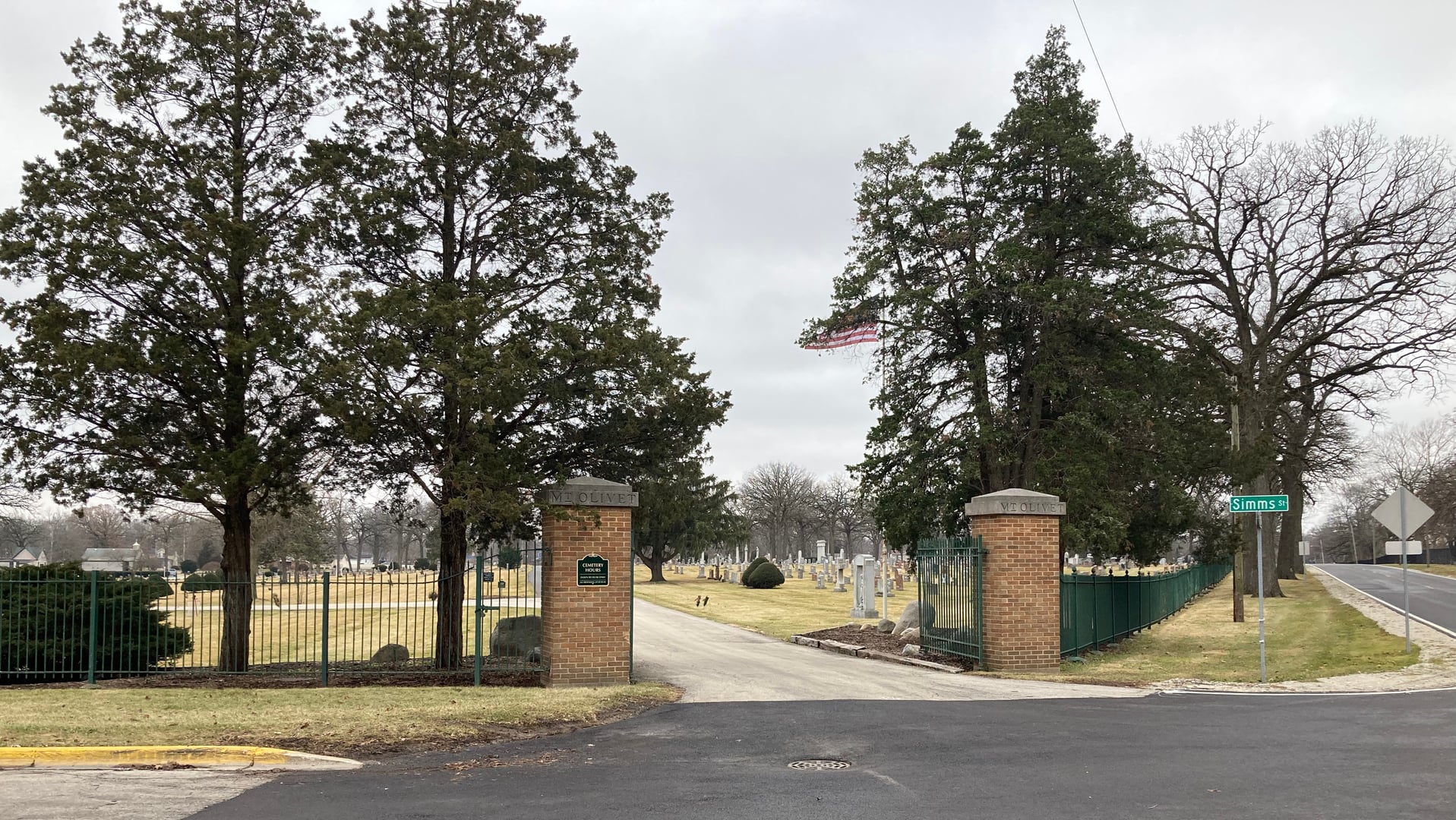The historic front entrance gates of Mount Olivet Cemetery in Aurora, Illinois — a Catholic cemetery established in 1850.