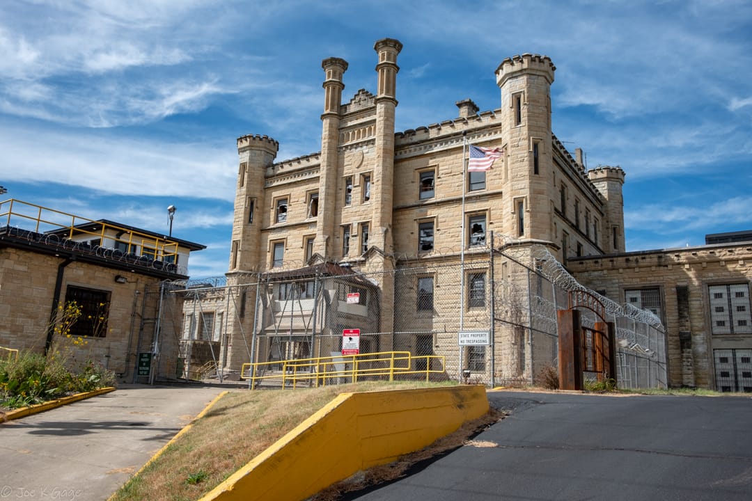 The main gate and entrance drive of Old Joliet Prison with its twin turrets, Joliet, Illinois.