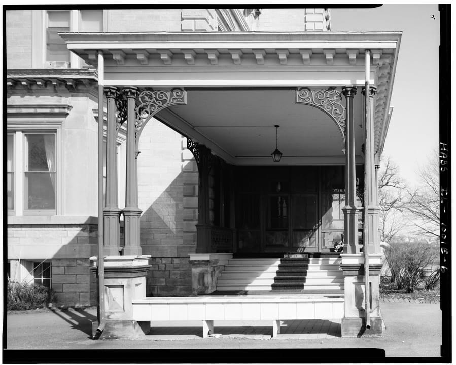 Close detail of Quarters One's ornate porte cochere (carriage entrance) on its east side, Rock Island Arsenal, HABS 1985.