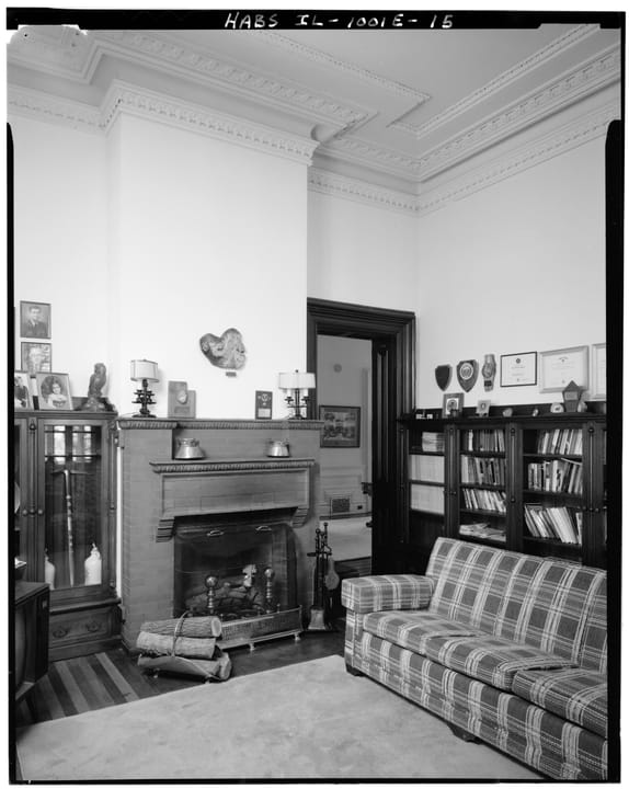 The library inside Quarters One, with its brick fireplace and built-in cabinets, Rock Island Arsenal, HABS 1985 -- a room shown on the house's public tours.