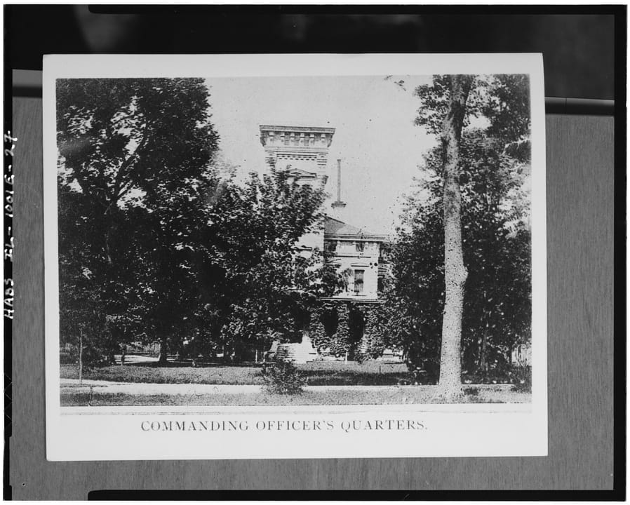 A circa-1887 photograph of Quarters One, captioned on the original print 'Commanding Officer's Quarters,' rephotographed from the Rock Island Arsenal Historical Office's print for the 1985 HABS survey.