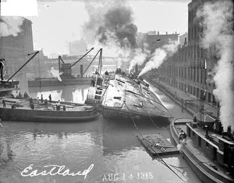 The SS Eastland lying on its port side in the Chicago River after the 1915 capsizing disaster