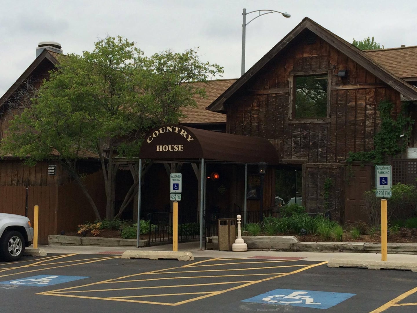 Front entrance of The Country House restaurant at 241 W 55th Street in Clarendon Hills, Illinois, a roadhouse-style tavern opened in 1922 by Emil Kobal.