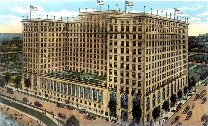 An illustrated colour picture postcard of the Drake Hotel from the lakefront corner, printed in 1920, showing the brick-and-limestone hotel with its low terrace wing and cars along the drive.