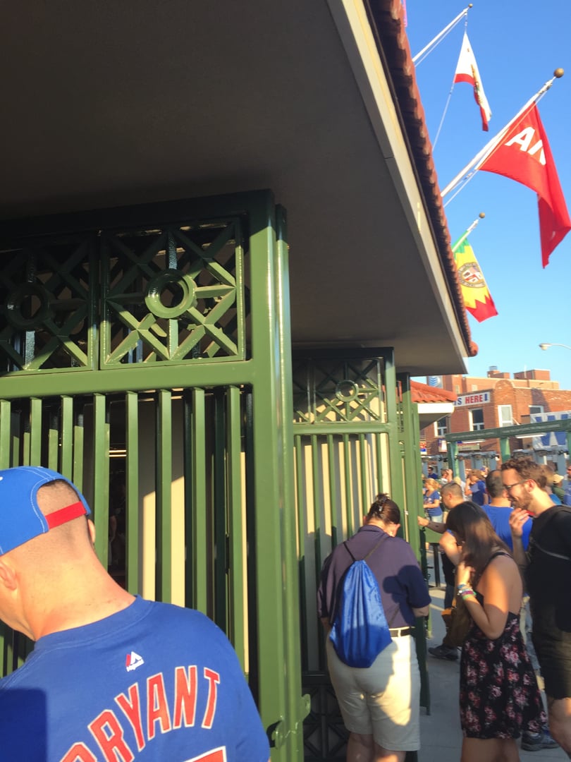 The iconic marquee and entrance gates of Wrigley Field in Chicago's Lakeview neighborhood