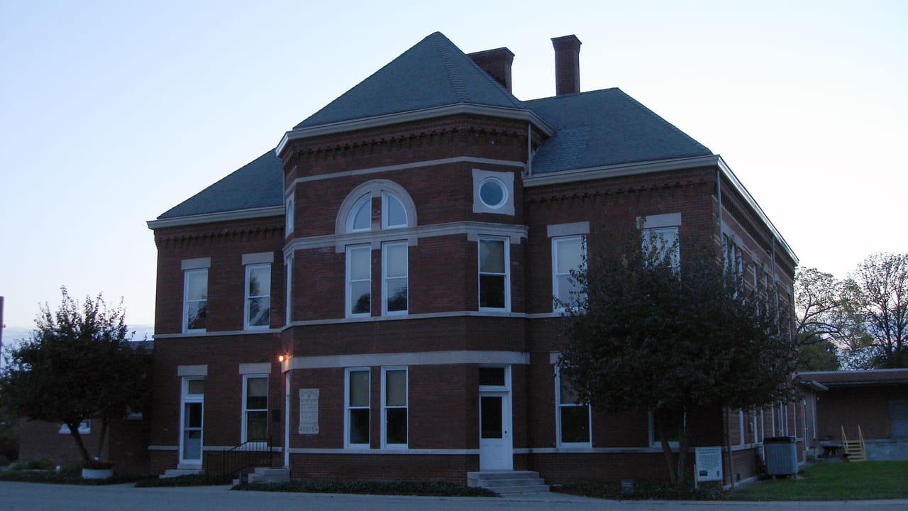 The 1895-96 Old Pathology Building on the grounds of Central State Hospital, viewed from a different angle and time of day (dusk/golden light) than the current hero photo.