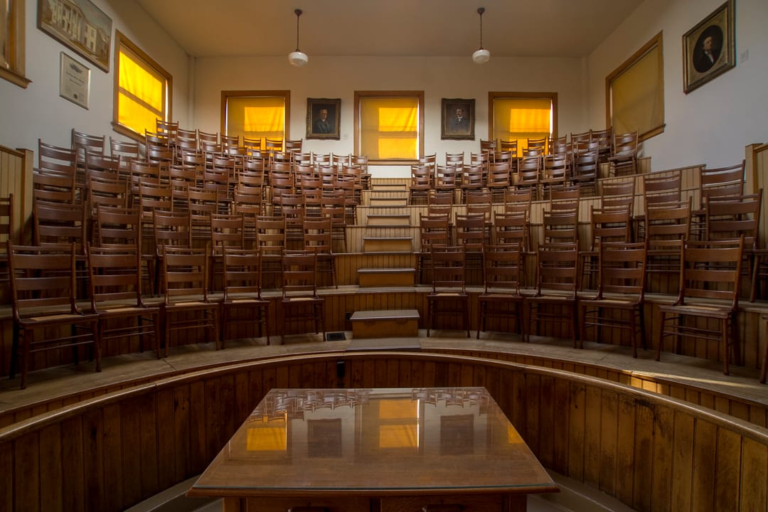 The empty tiered teaching amphitheater in the Old Pathology Building (Indiana Medical History Museum), Indianapolis, seen from the front of the room in 2013.