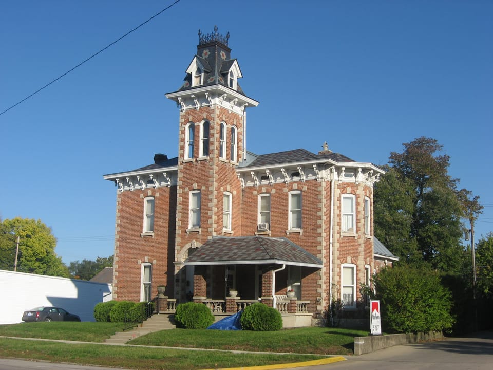 Front of the Elias Hinshaw House, located at 16 W. Main Street (U.S. Route 40) in Knightstown, Indiana, United States.  Built in 1883, it is listed on the National Register of Historic Places, and it is part of a Register-listed historic district, the Knightstown Historic District.