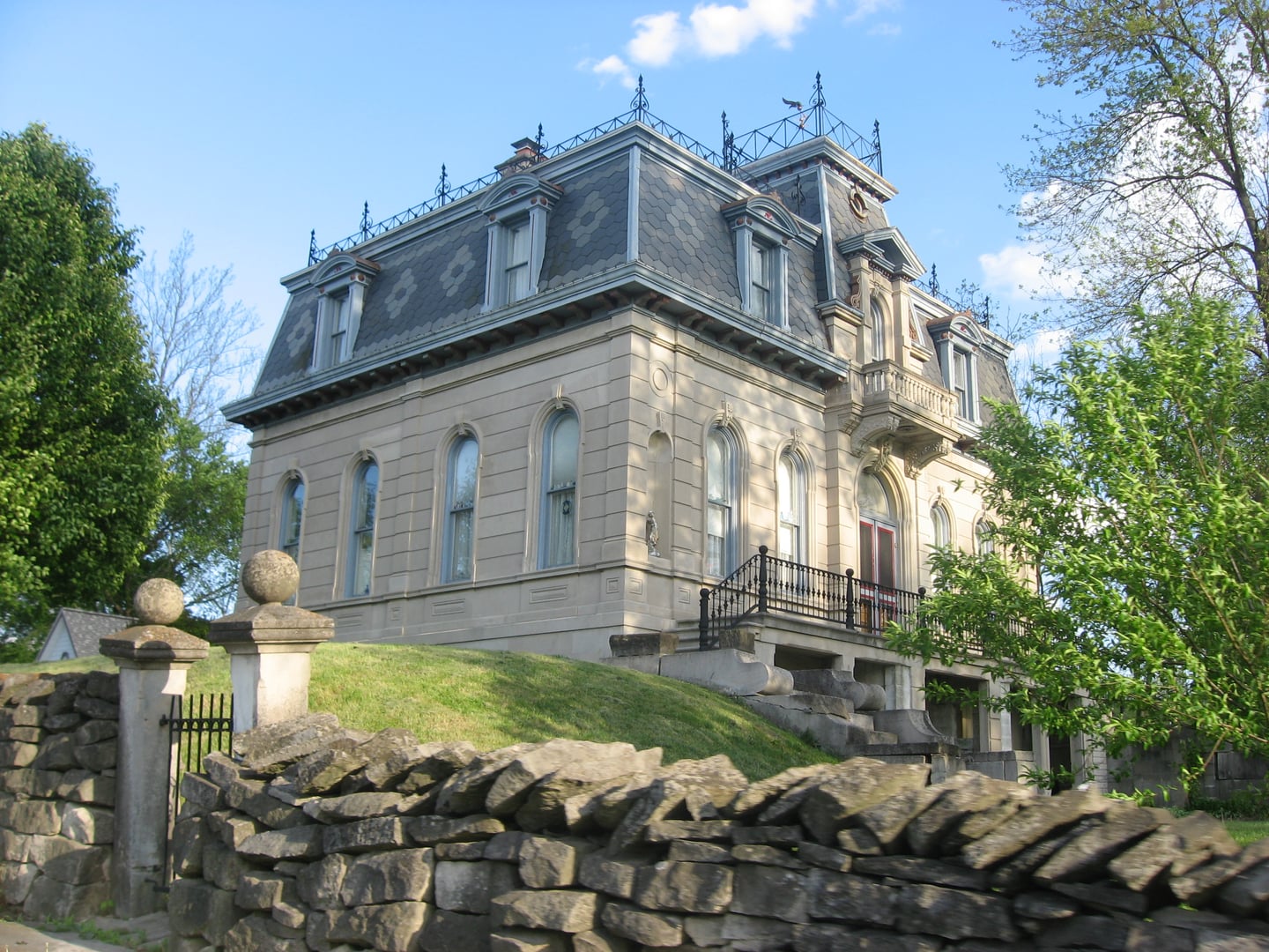 The mansard-roofed limestone exterior of the 1874 Matthews Mansion (Graymont) on Maple Grove Road north of Ellettsville, in Monroe County, Indiana.