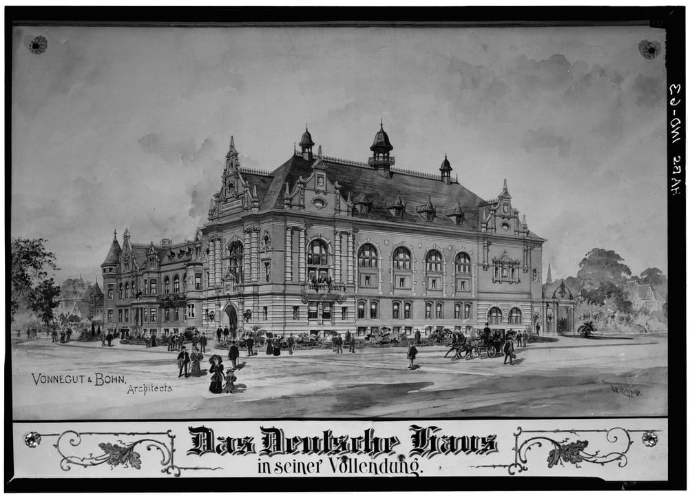 Historic engraved view of Das Deutsche Haus (now the Athenaeum) titled "in seiner Vollendung" (on its completion), with horse-drawn traffic on Michigan Street; credited Vonnegut & Bohn, architects.