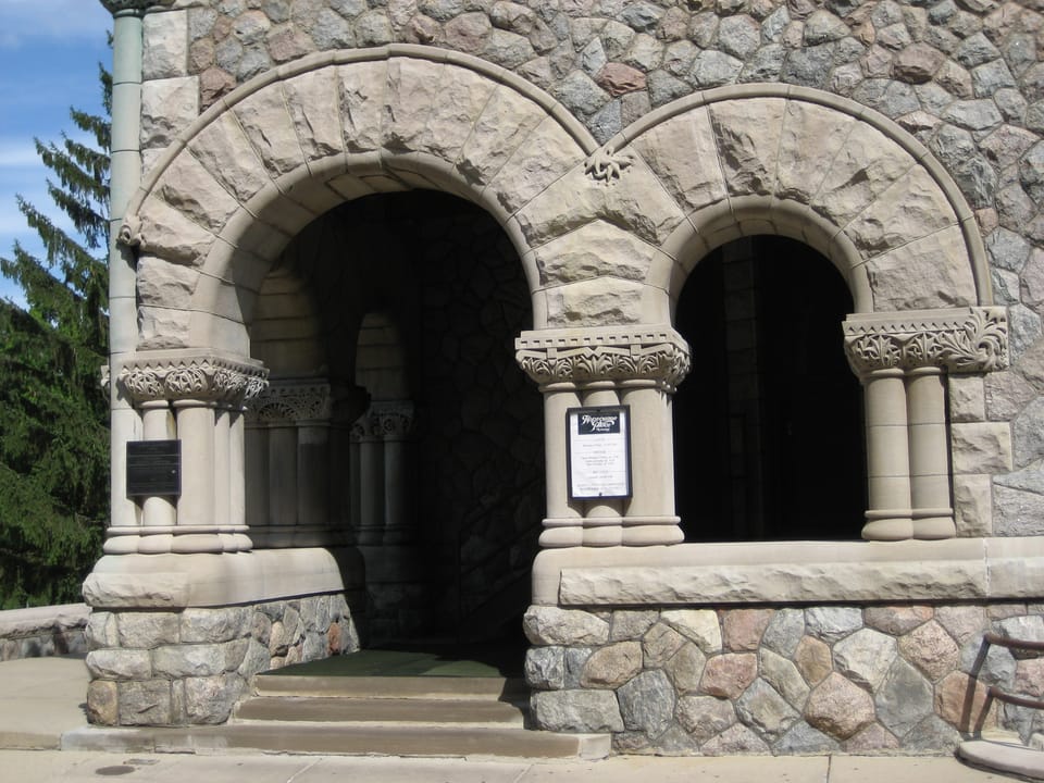 Twin carved stone arches at the main entrance to Tippecanoe Place, South Bend, Indiana, 2007.