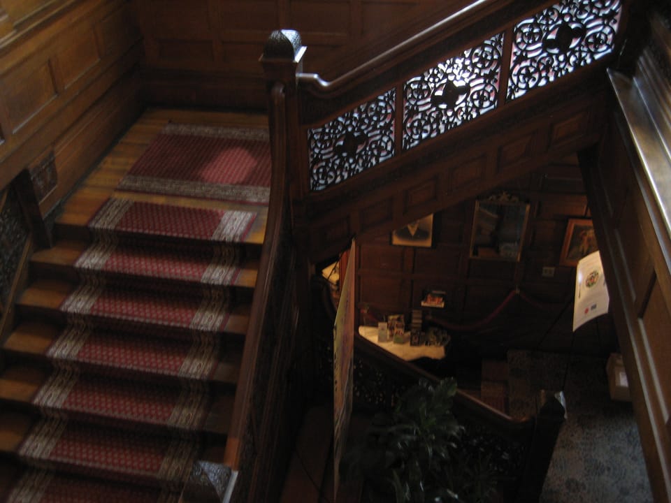 Staircase and carved handrail detail inside Tippecanoe Place, South Bend, Indiana, 2007.