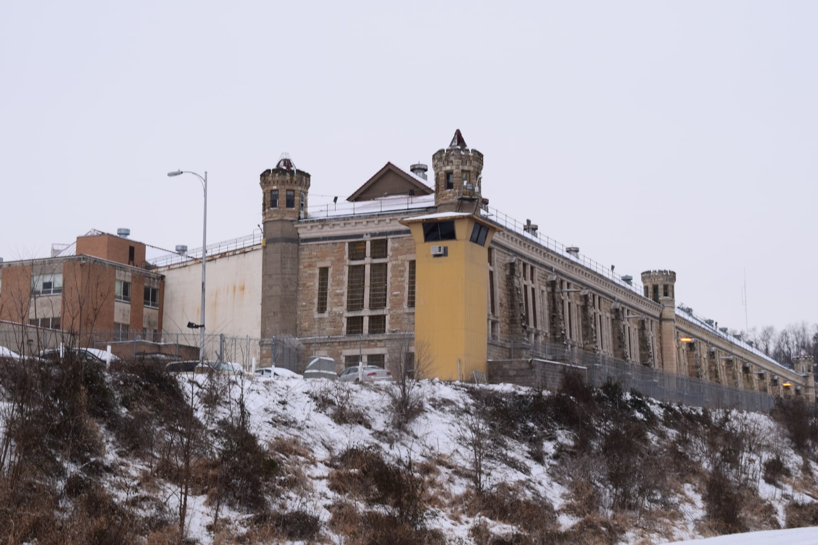 Historic Iowa State Penitentiary stone walls and guard towers in Fort Madison, Iowa
