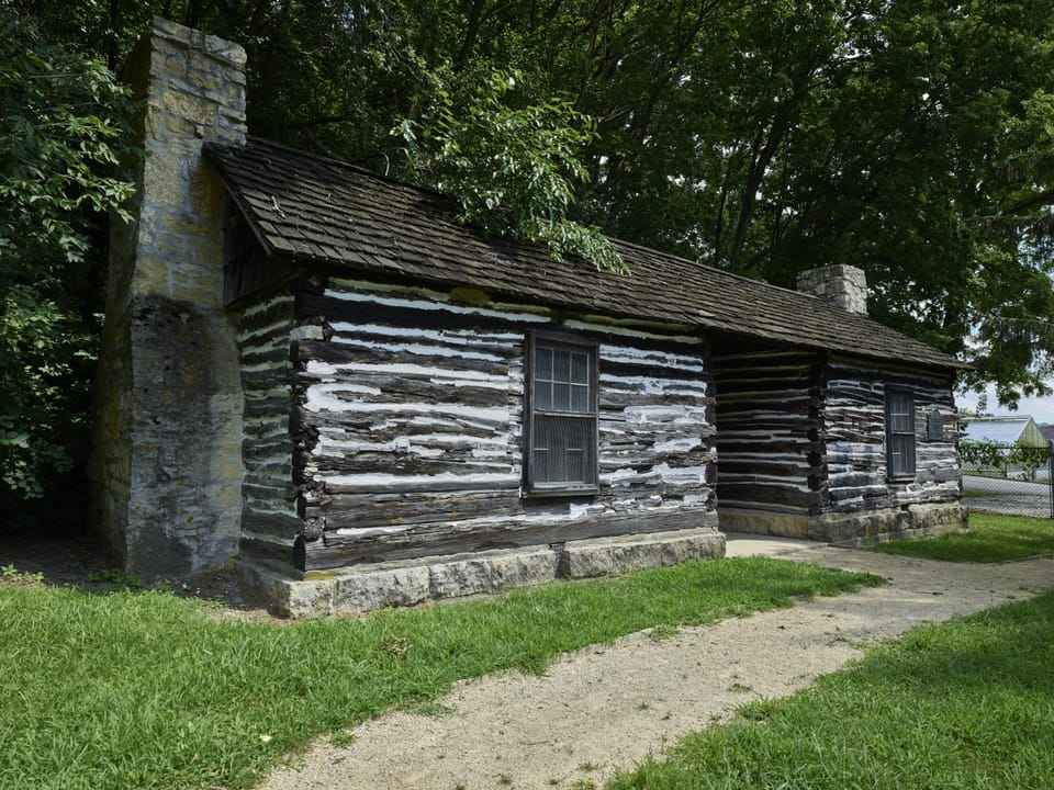 A log cabin on the grounds of the Mathias Ham House Historic Site, built around 1827 and identified by local researchers as the oldest-known standing building in Iowa.