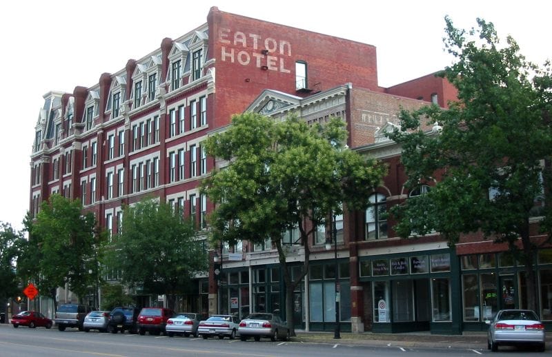 The Carey House / Eaton Hotel, a five-story brick building on East Douglas Avenue in downtown Wichita, with 'EATON HOTEL' painted on its upper side wall, photographed in July 2006.
