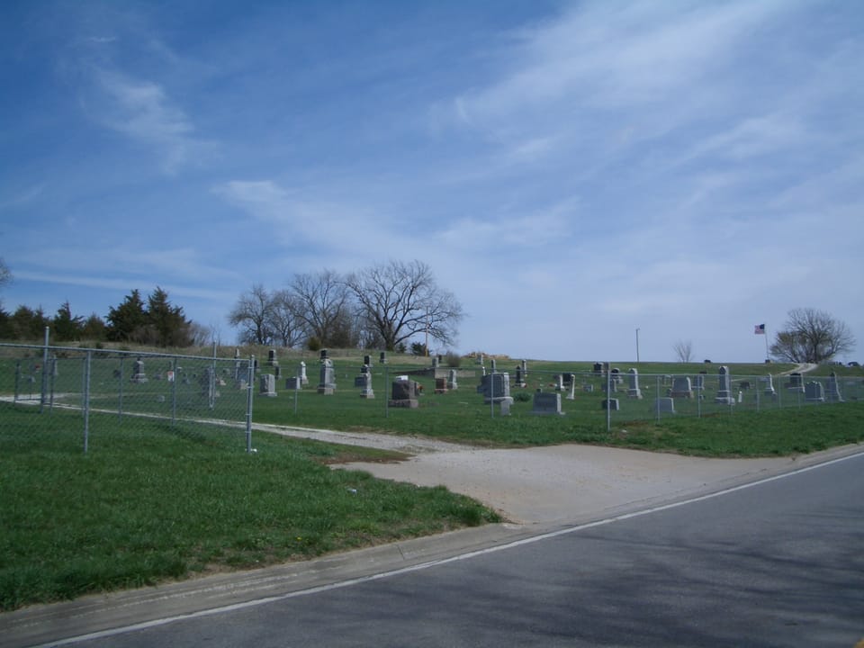 Stull Cemetery viewed from the roadside with its perimeter chain-link fence, Stull, Kansas, 2007.