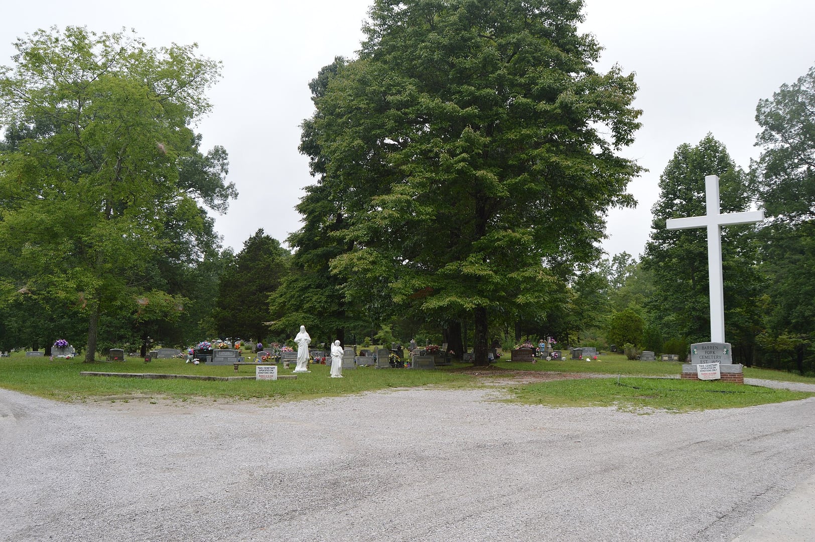 Overview of Barren Fork Cemetery from the parking area, a hilltop coal-camp burial ground off US 27 near Whitley City in McCreary County, Kentucky