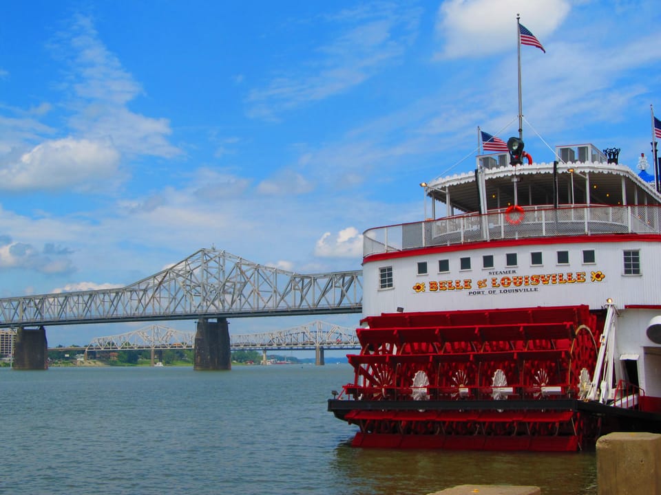 The Belle of Louisville moored at the downtown Louisville wharf, 4th Street and River Road, with the George Rogers Clark Memorial Bridge behind her, July 4, 2011.