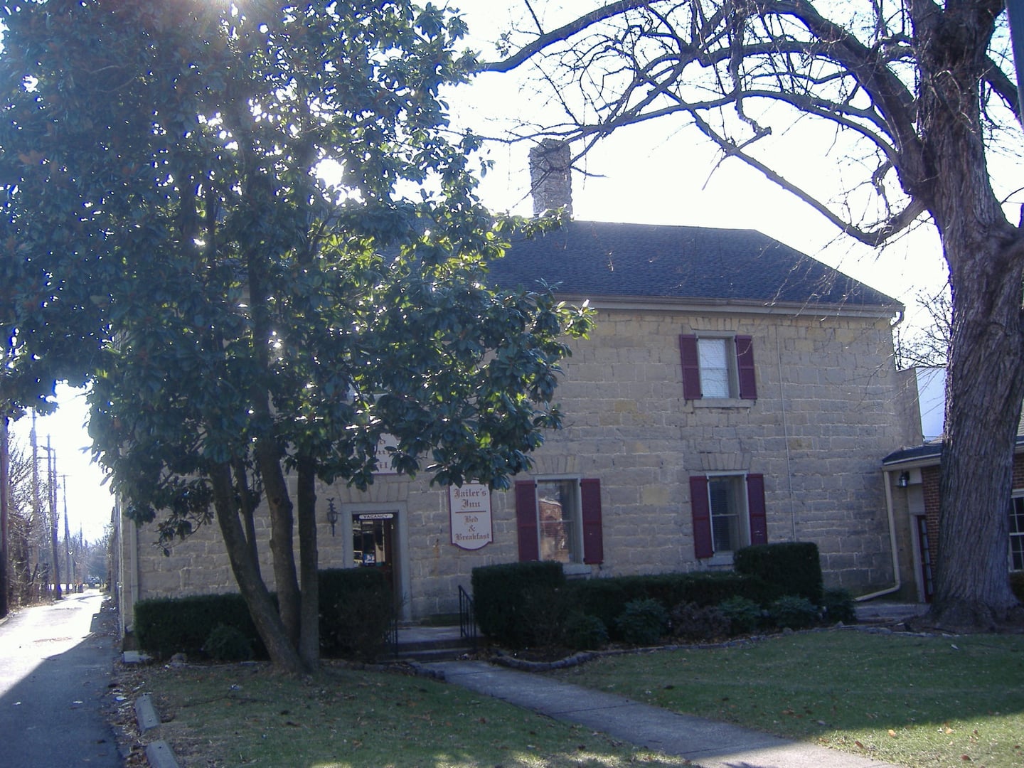 1819 limestone facade of Jailer's Inn Bed and Breakfast at 111 W Stephen Foster Ave, Bardstown, Kentucky