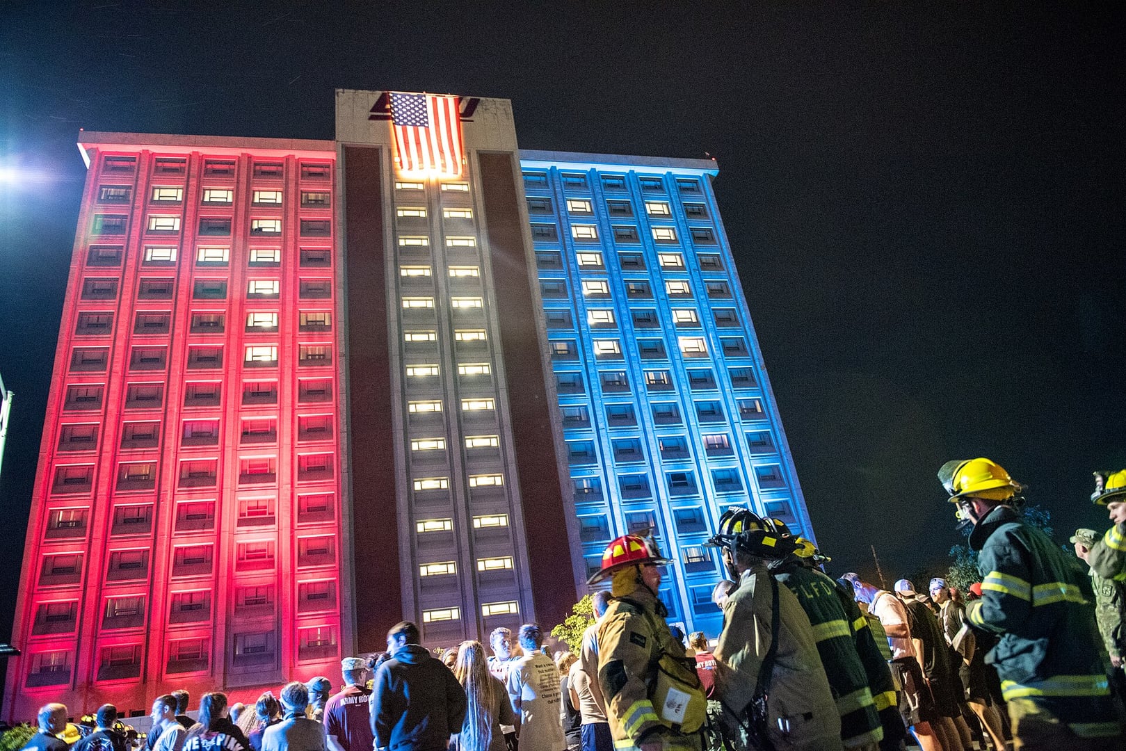 Keene Hall, the 16-story dormitory tower at Eastern Kentucky University in Richmond, lit red, white and blue with an American flag during a 9/11 Memorial Stair Climb event