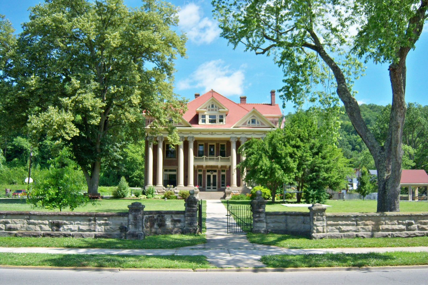 Distant view of the three-story 1912 Mayo Mansion in Paintsville, Kentucky, designed by Herman Geisky for coal magnate John C.C. Mayo, now housing Our Lady of the Mountains School.