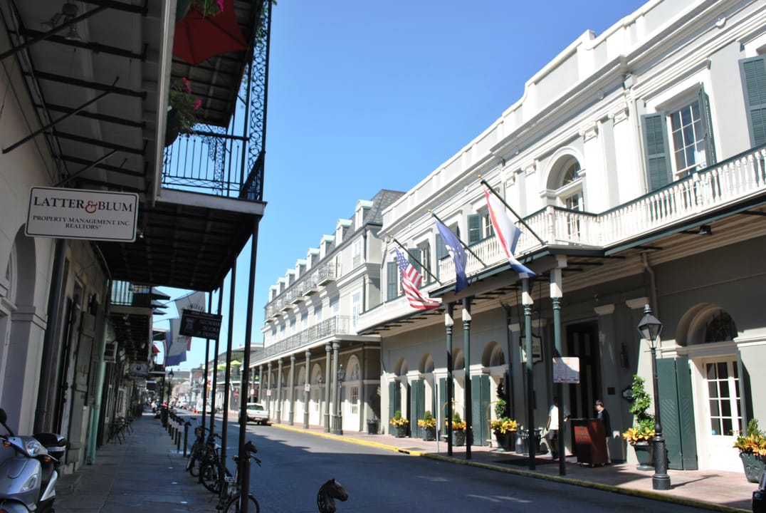 Daytime street-level view of the Bourbon Orleans Hotel's cast-iron-galleried facade along the 700 block of Orleans Street, French Quarter, 2011.