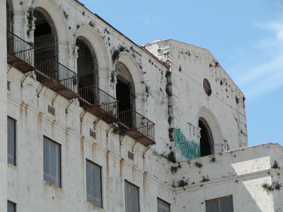 Close detail of the upper-story arched balconies on the Heidelberg Hotel building, photographed vacant before its renovation into the Hilton Baton Rouge Capitol Center, April 2005.