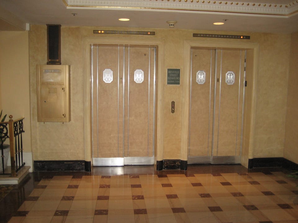 Brass elevator bank in the Hotel Monteleone lobby, New Orleans French Quarter.