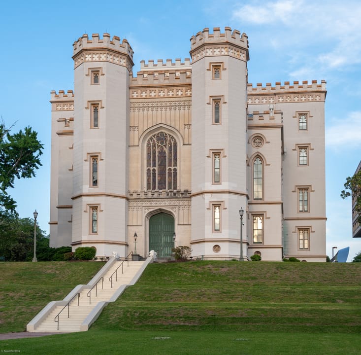 The Old State Capitol's front steps and entrance, straight-on daytime view, April 2024.