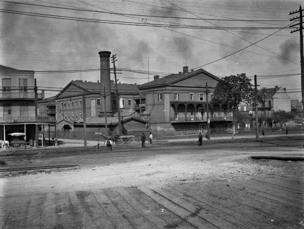 Historic c.1900 view of the Old US Mint in New Orleans (1835) seen from the levee near Governor Nicholas Wharf, now home to the New Orleans Jazz Museum.